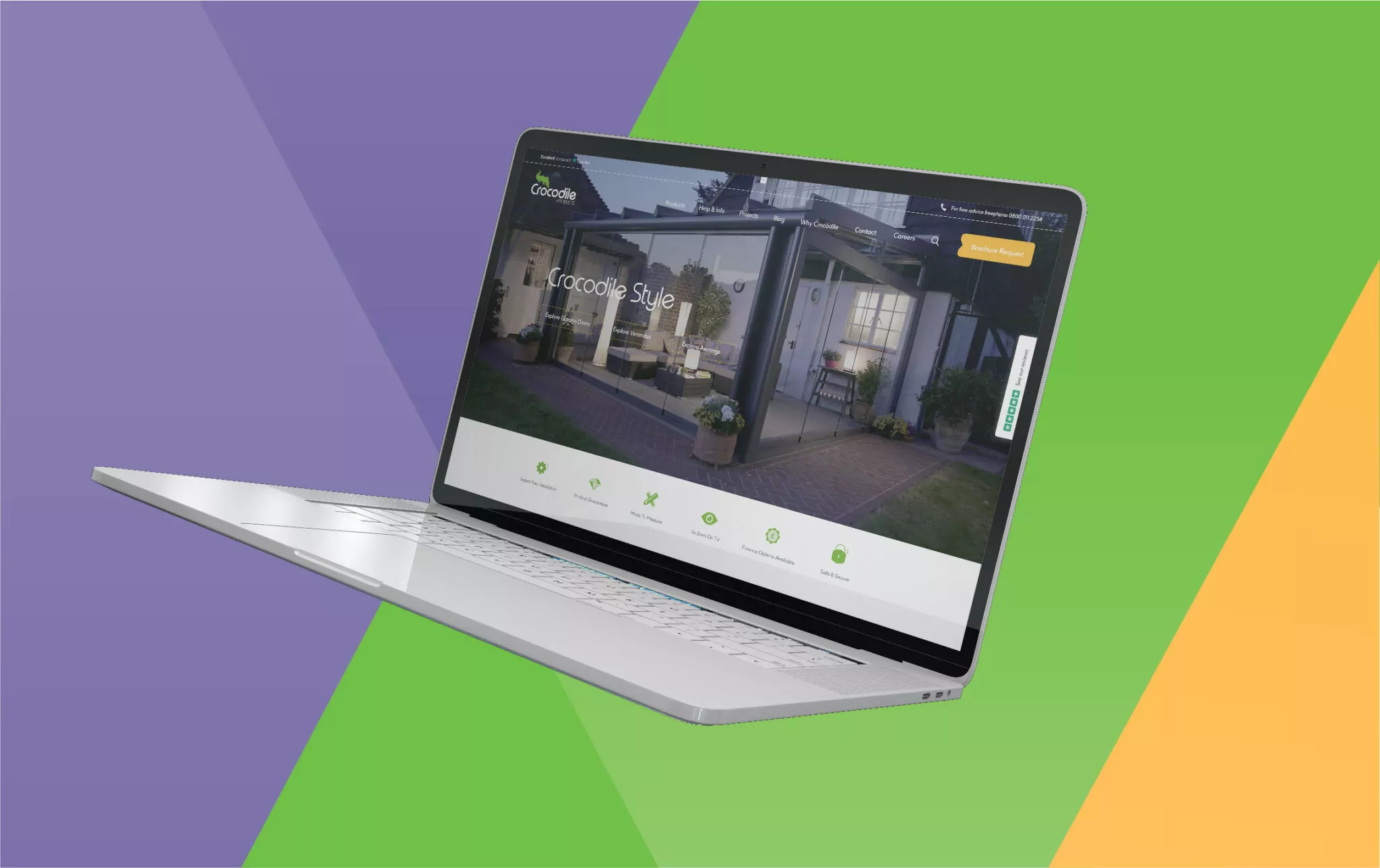 A silver laptop displays a website showcasing a glass conservatory; it's against a vibrant green, purple, and orange background. The website headline reads, "Crocodile Style". A "Brochure Request" button is visible.