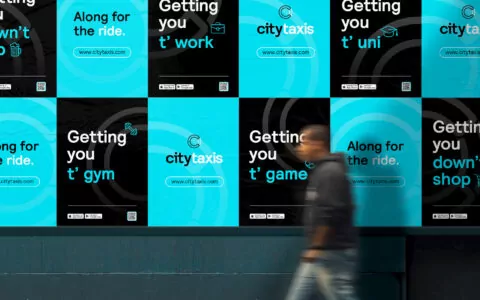 wall covered with City Taxis advertisements